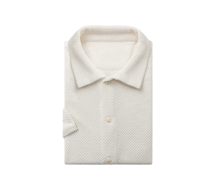 Alt TextCustom made textured cream polo shirt for men in Jacksonville Florida made from Pima cotton for casual business travel and summer wear#custompolos #jacksonvilleflorida #mensstyle #tailoredpolos #businesscasualstyle