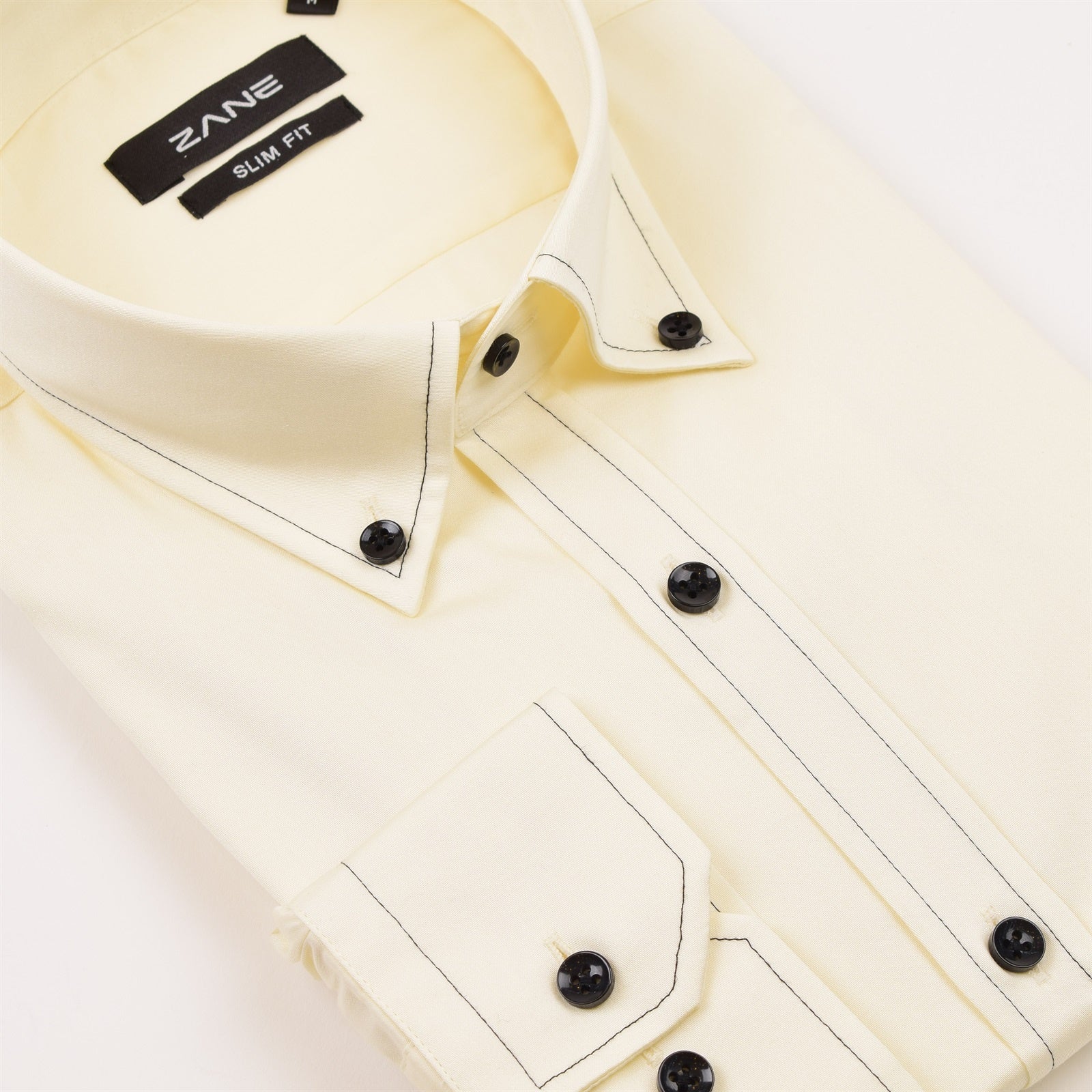 A cream-colored slim fit shirt with long sleeves, featuring a cutaway collar and button-up front, displayed on a plain background. Ivory Italian cutaway slim fit dress shirt mens long sleeve cotton formal shirt Jacksonville formalwear Zane Suits and Tuxedos