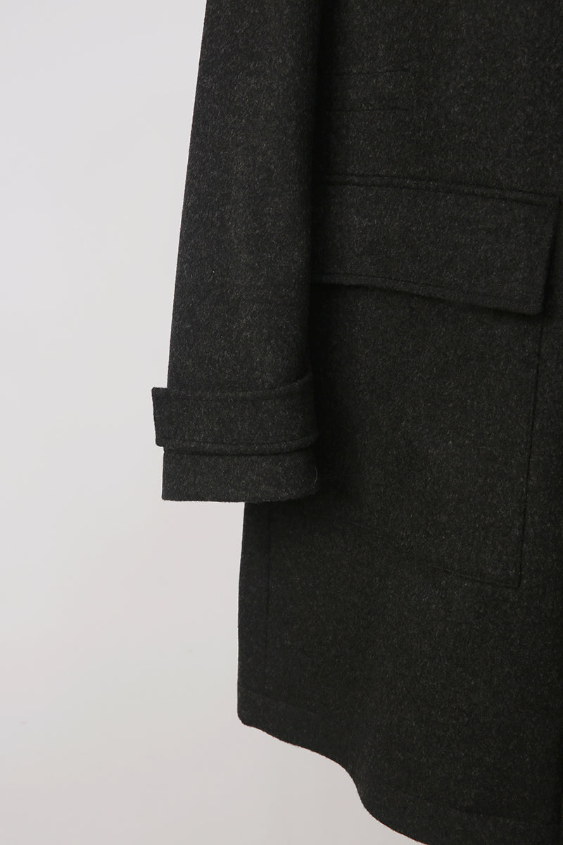 Dark gray coat with a pocket on a light gray background