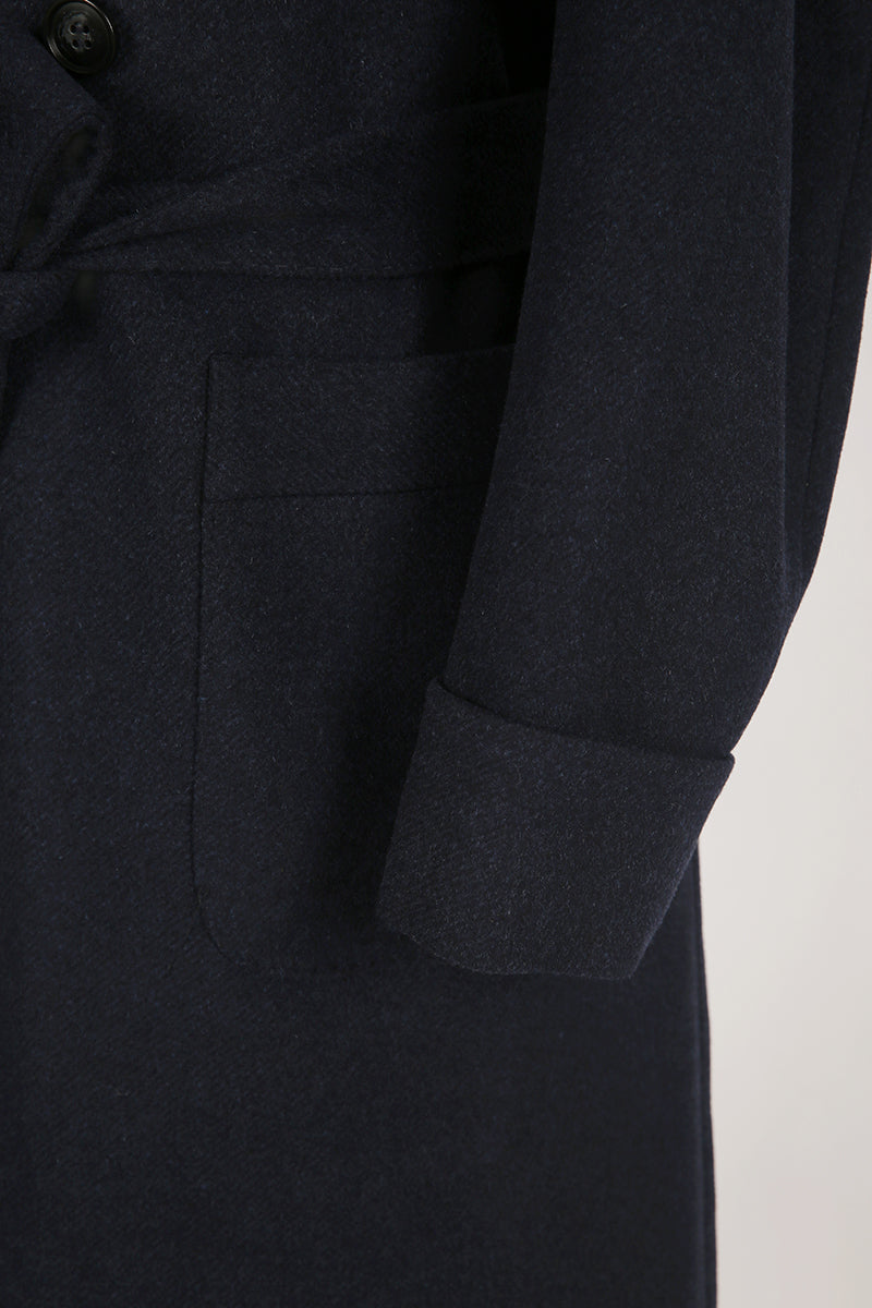 Dark gray coat with a buttoned front on a white background