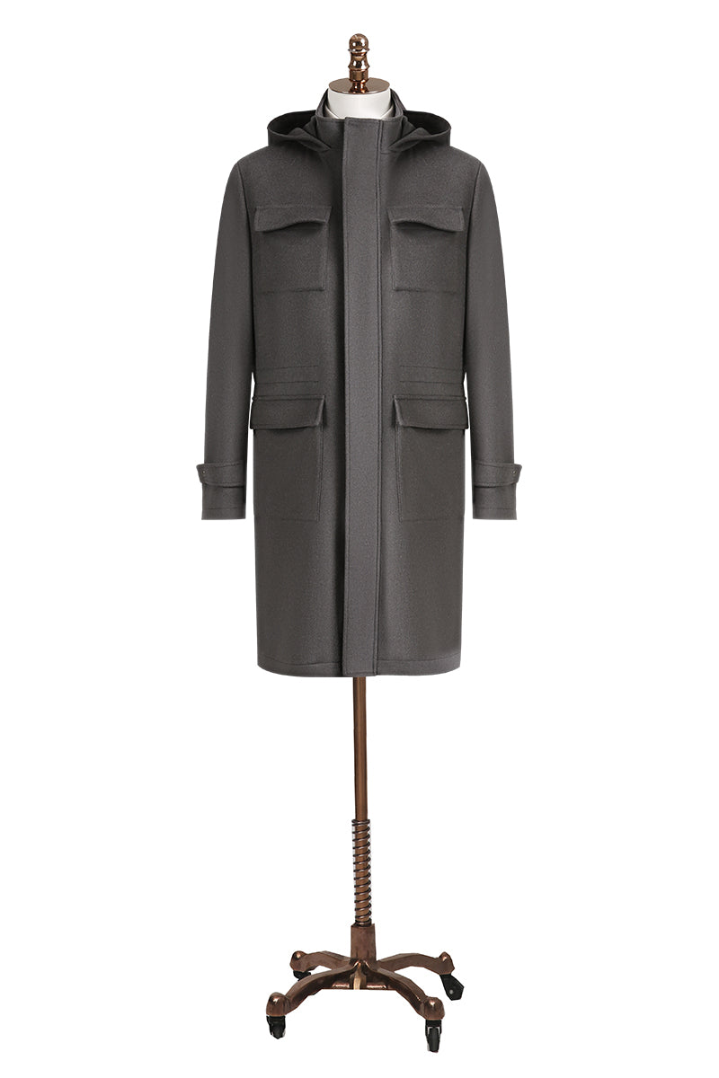 Gray coat on a mannequin stand against a white background