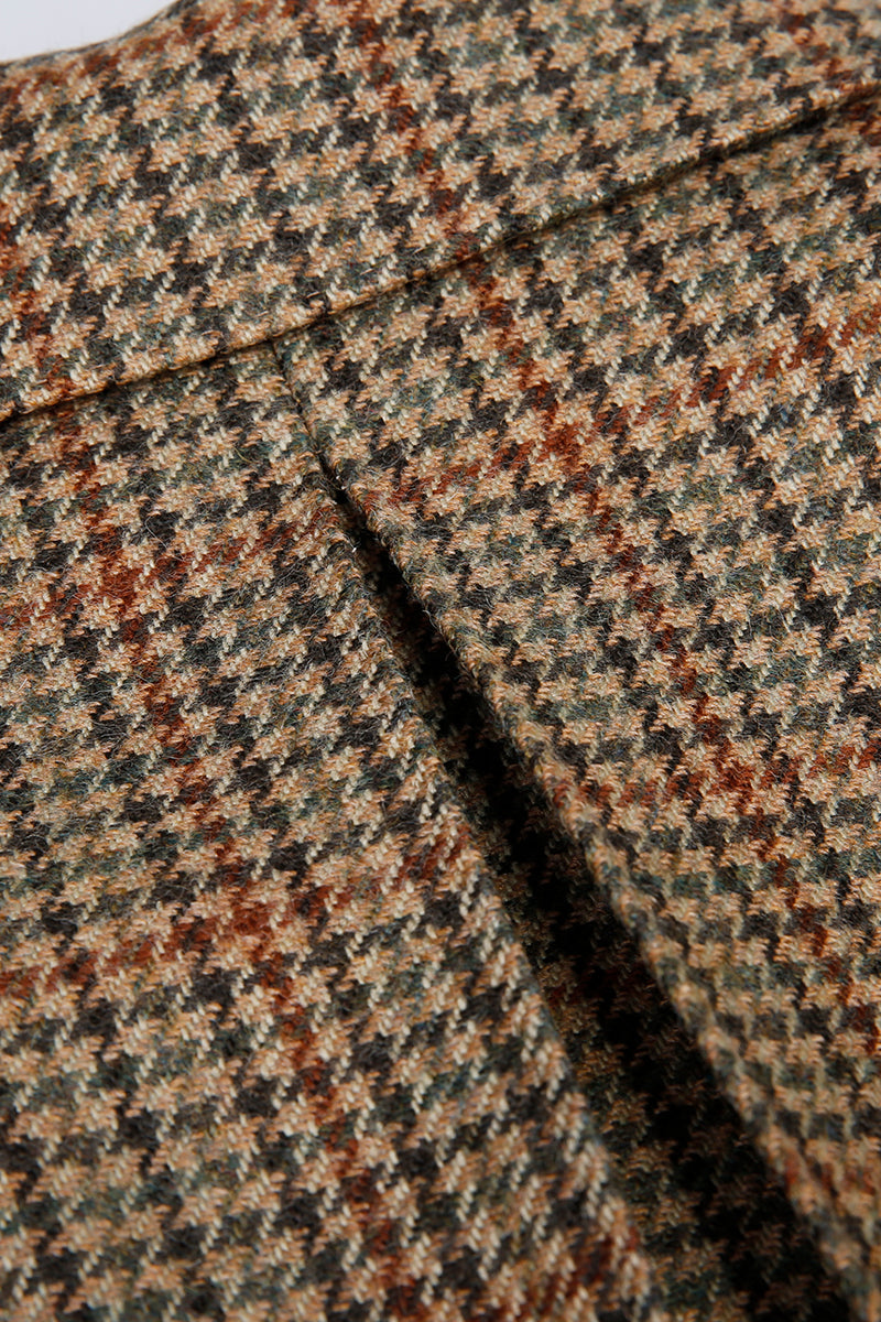 Close-up of a houndstooth pattern fabric with brown, black, and beige colors. office wear 