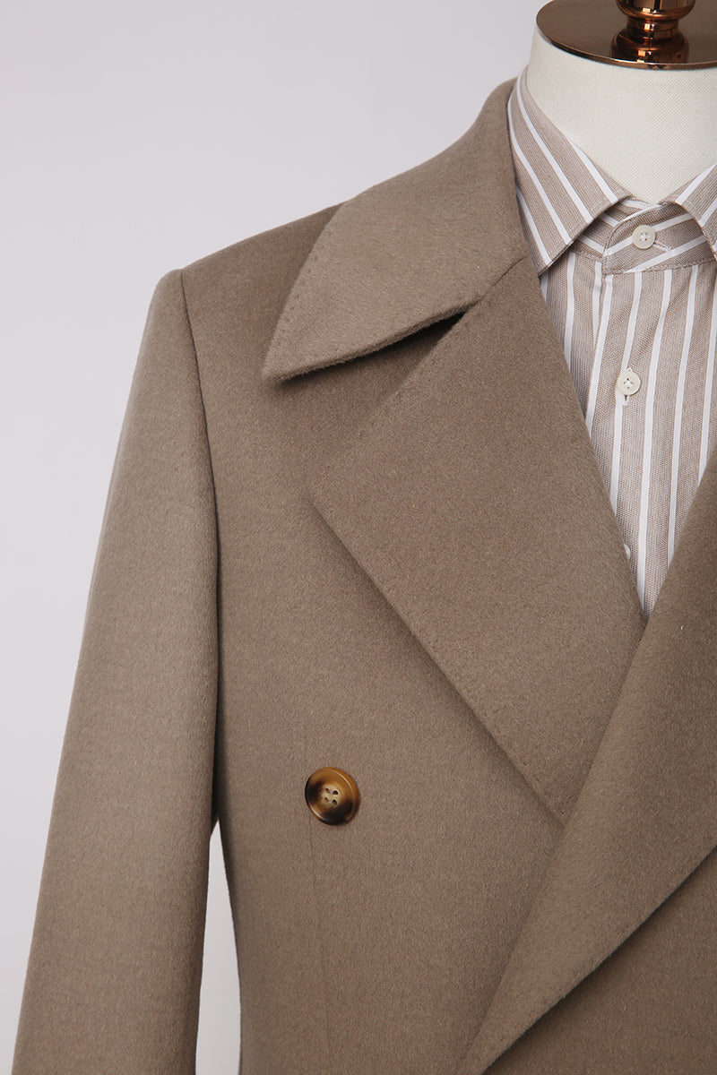 Brown coat on a mannequin with a white background