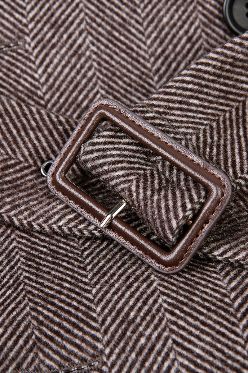 Close-up of a brown herringbone fabric with a buckle