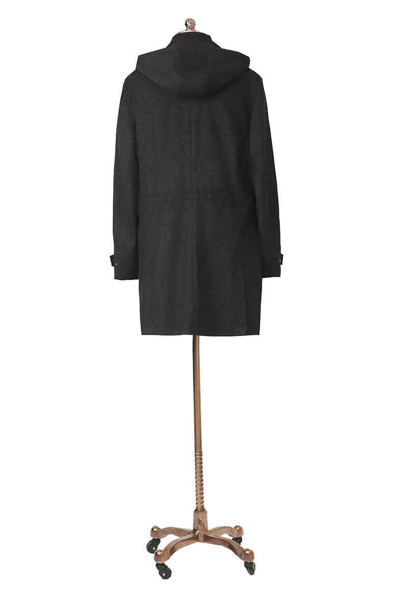 Black coat on a mannequin against a white background